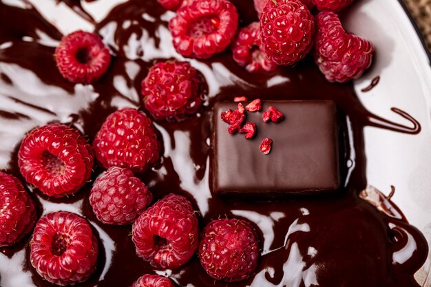 Candies and raspberry in hot chocolate.