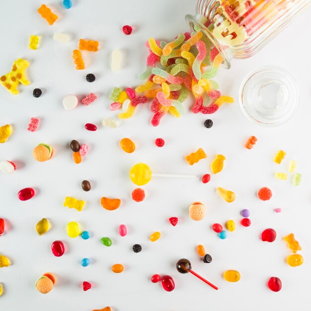 Candies spilled from glass jar