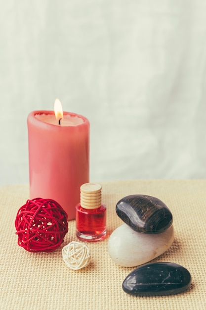 Candle, stones and lotion