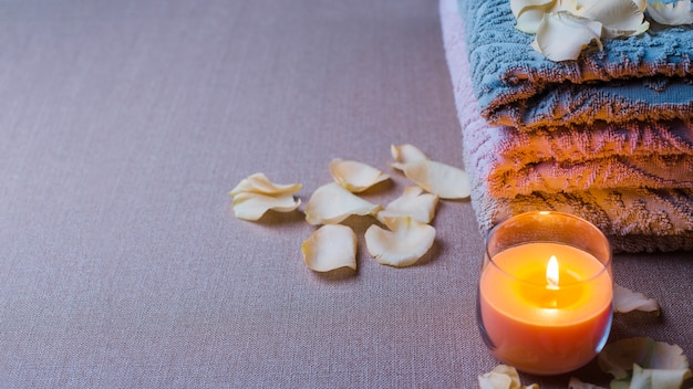 Candle and towels in spa