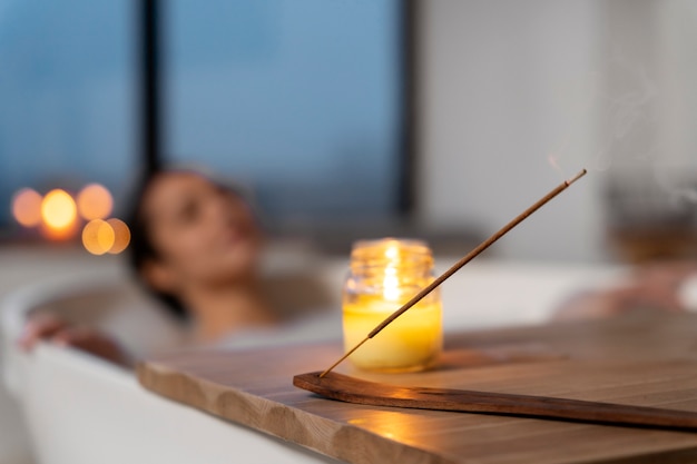 Candle used by a woman to relax during a bath