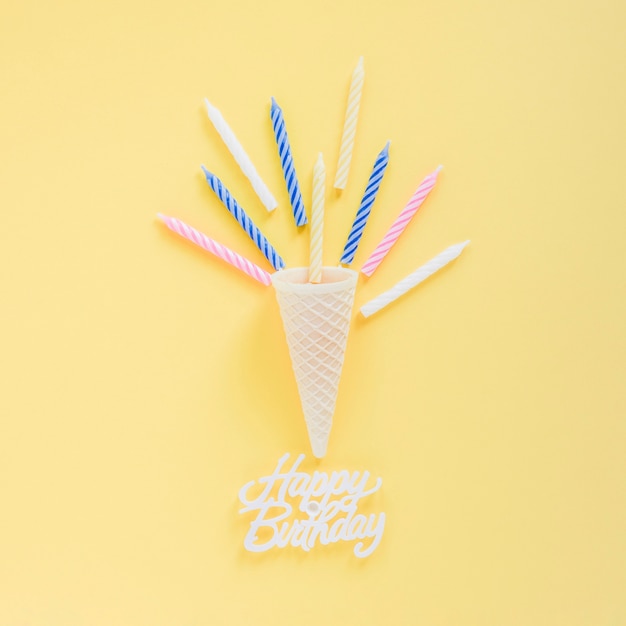 candles near waffle cone and writing