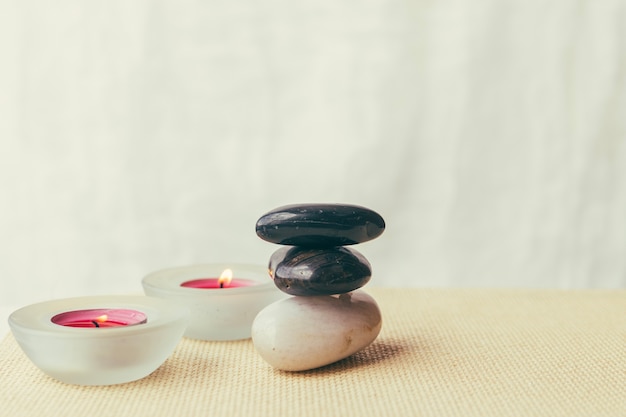 Free photo candles and pile of stones