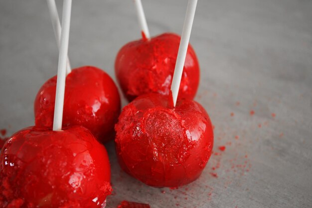 Candy apples on grey background