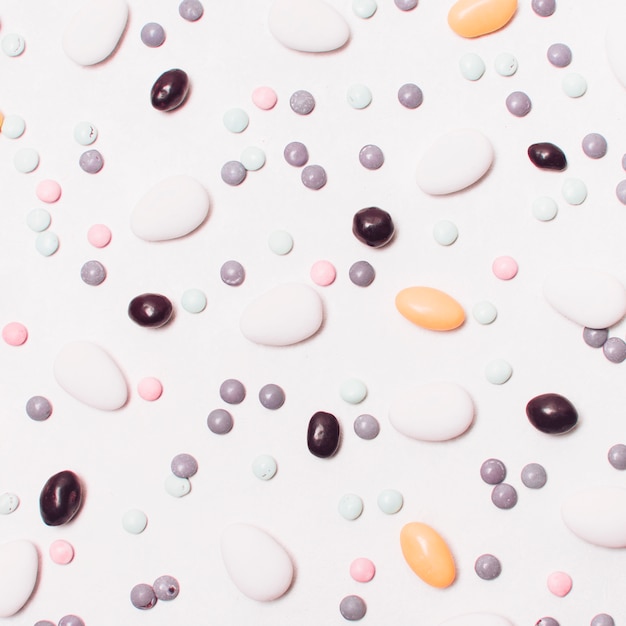 Candy background with dragees and sprinkles 