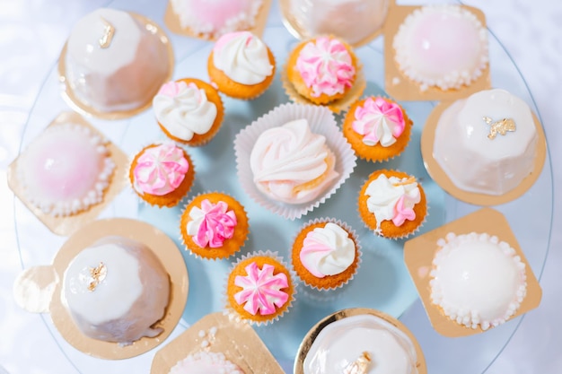 Candy bar and wedding cake. table with sweets  buffet with cupcakes  candies  dessert