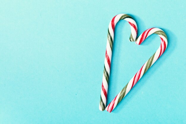 Candy canes composed on blue