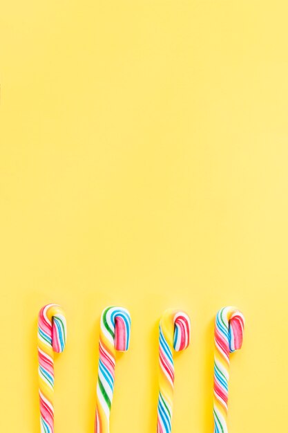 Candy canes on orange background