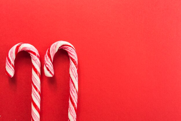 Candy canes on red