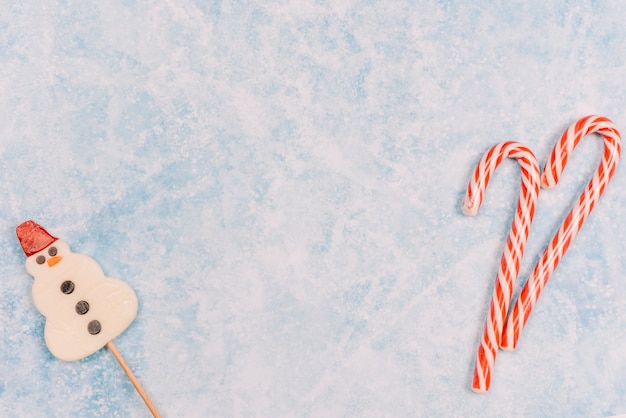 Candy canes and snowman shaped lollipop