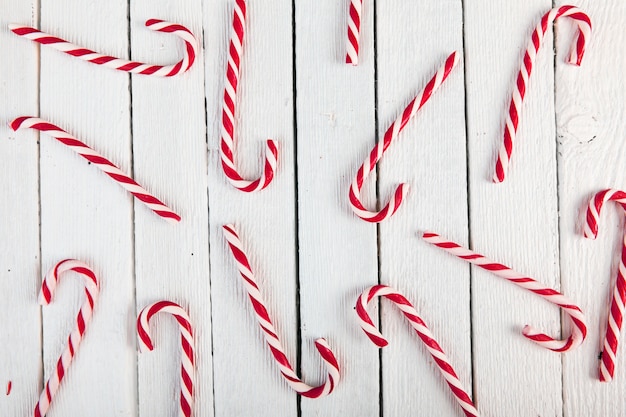 Candy canes on wood board 