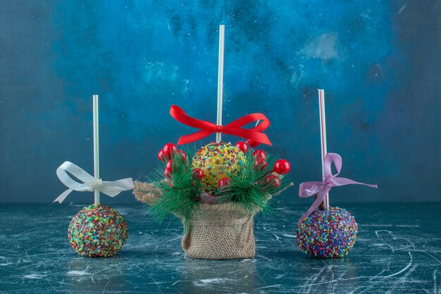 Candy coated lollipops on blue background. High quality photo