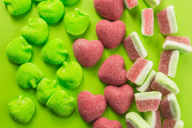 Candy hearts near gummies