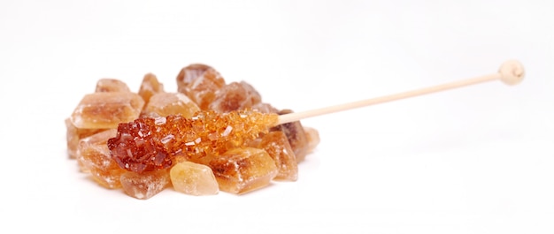 Candy sugar on a stick over white background