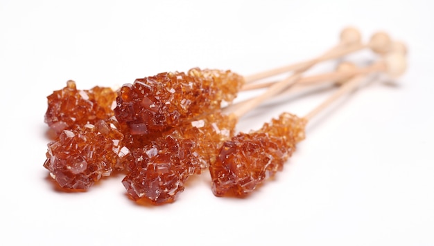 Candy sugar on a stick over white background