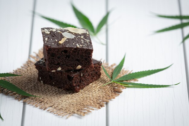 Cannabis brownies and cannabis leaves put on fabric