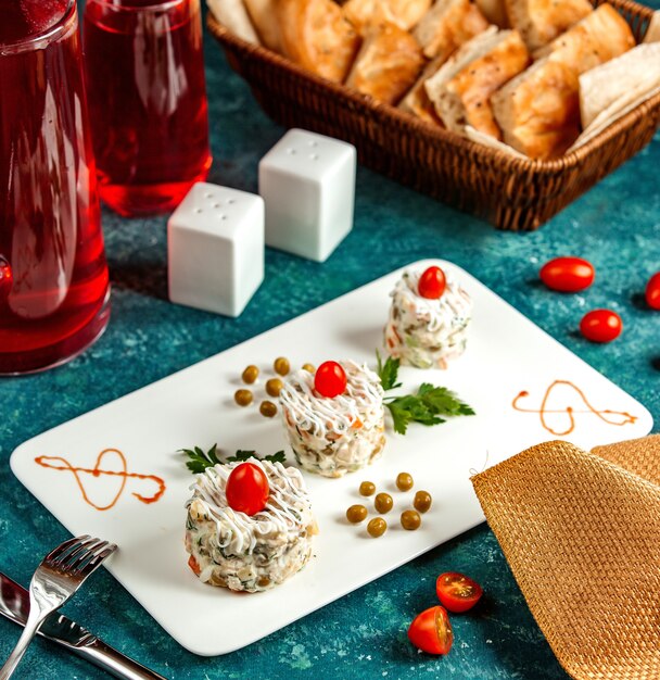 Capital salad on a rectangular plate with tomatoes