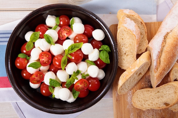 Caprese salad with mozzarella and bread