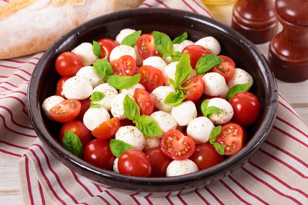 Caprese salad with mozzarella cheese in a bowl