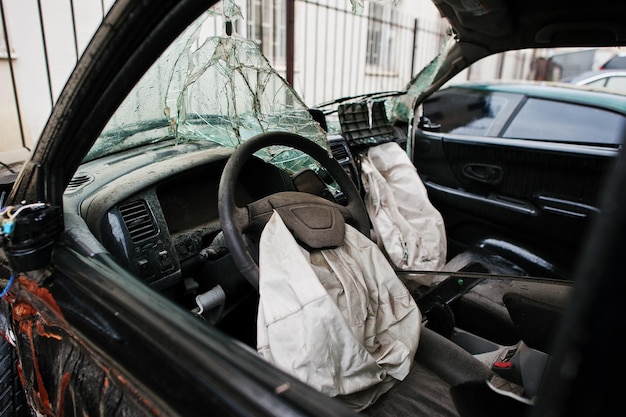 Free photo car after accident car interior with airbag after crash