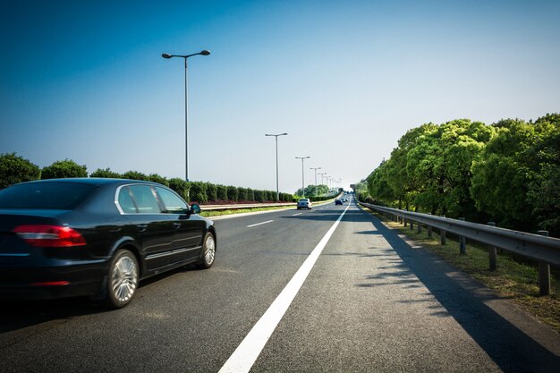 Car on asphalt road in summer