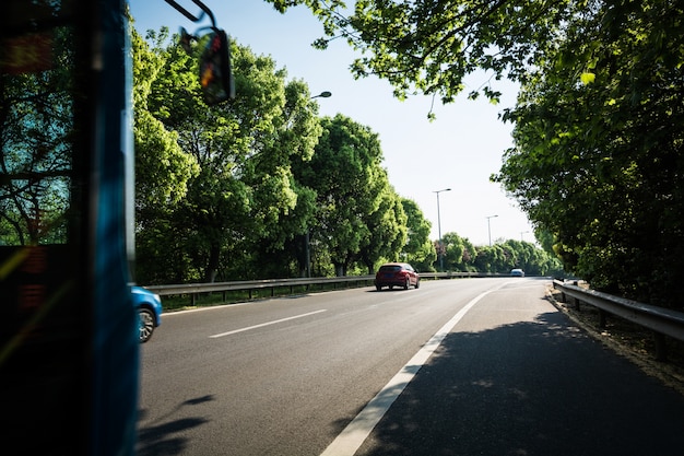 Car on asphalt road in summer