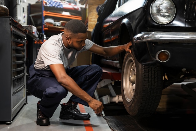 Car being taking care of in workshop