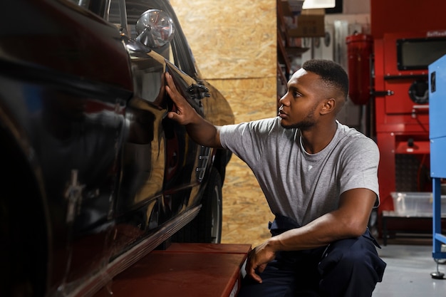 Free photo car being taking care of in workshop