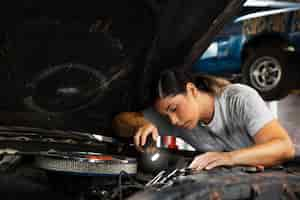 Free photo car being taking care of in workshop