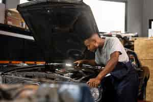 Free photo car being taking care of in workshop