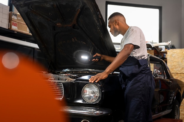 Car being taking care of in workshop