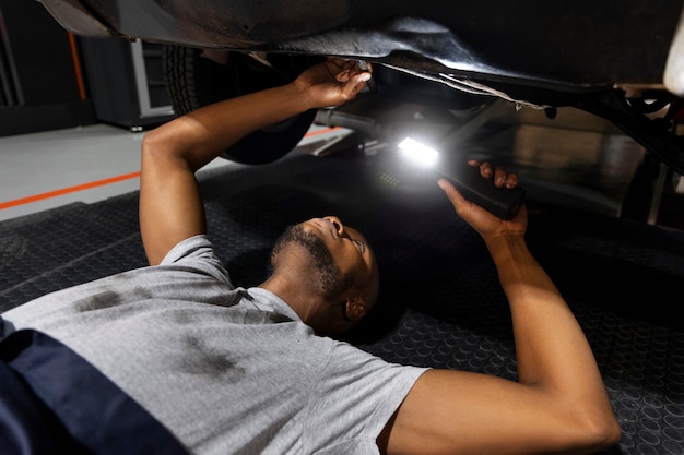 Free photo car being taking care of in workshop