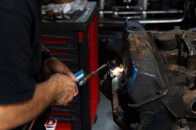 Car being taking care of in workshop