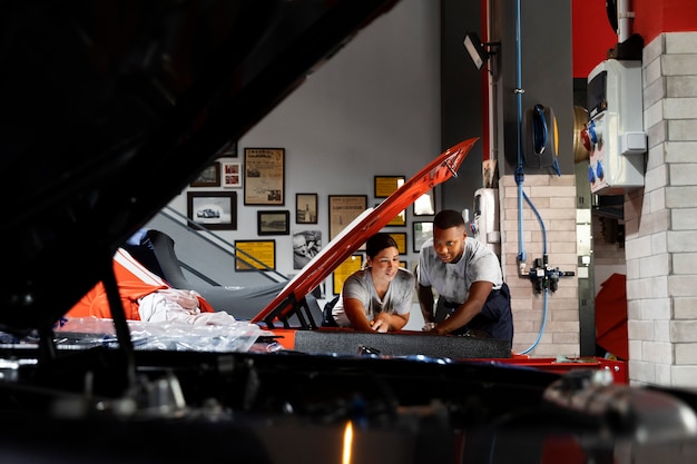 Car being taking care of in workshop