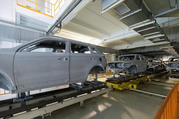 Car bodies are on assembly line Modern automotive industry Automobile conveyor