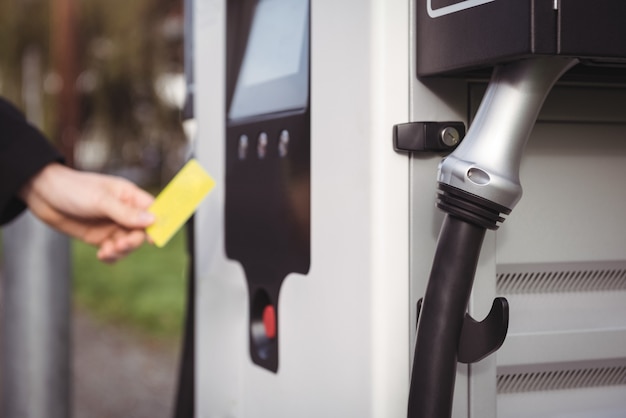 Car charger at electric vehicle charging station