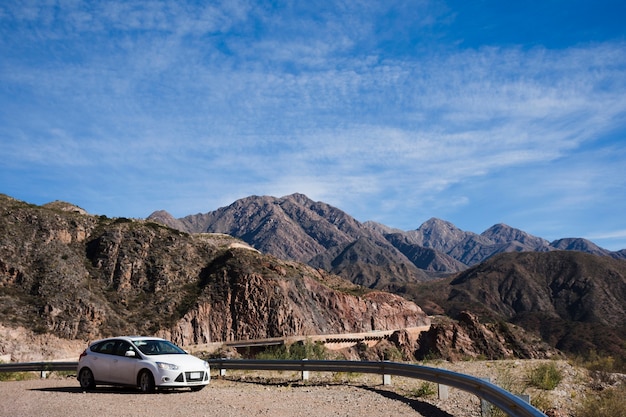 Car in front of mountain landscape