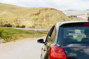 Free photo car riding on road in nature