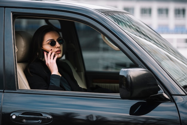 Car with woman monitored by security