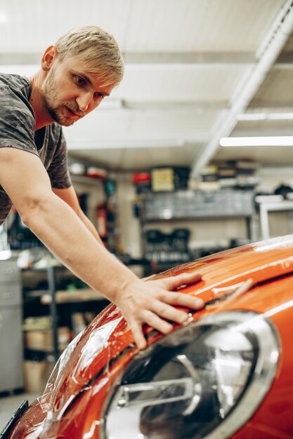 Car wrapping with foil at car service