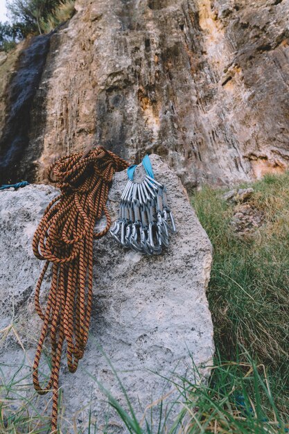 Carabiners and rope on rock