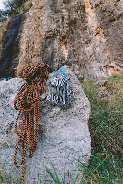 Carabiners and rope on rock