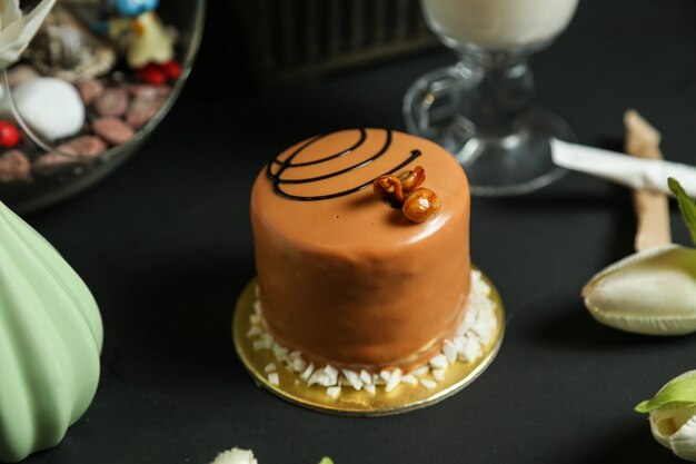 Caramel cake with chocolate decoration side view