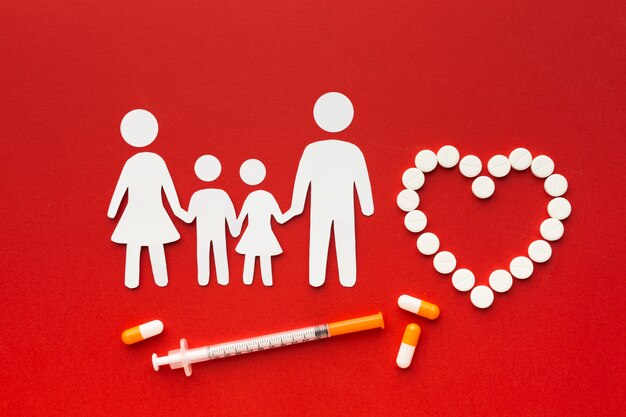 cardboard family shapes with drugs and syringe