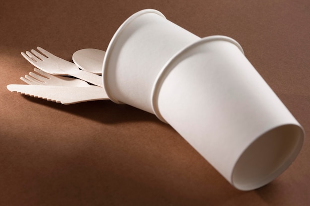 Cardboard knife and fork in overturned cups