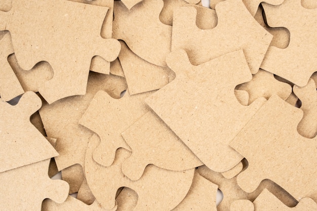 Cardboard puzzles as a background close up.