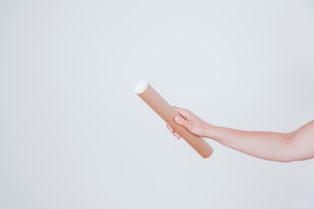 Cardboard tube in hand