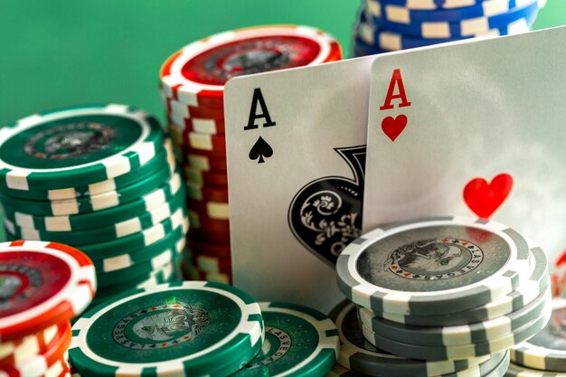 Cards and chips for poker on green table