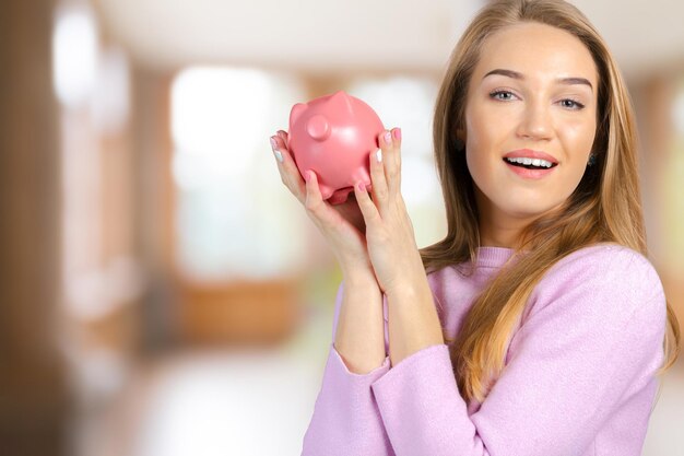 Care for savings  woman with a piggy bank