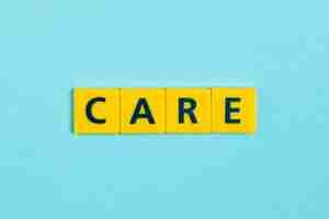 Free photo care word on scrabble tiles